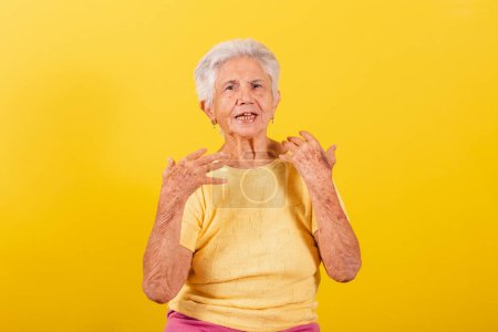 Photo for Old lady, calling with her hands, inviting, welcome, come, come here. - Royalty Free Image