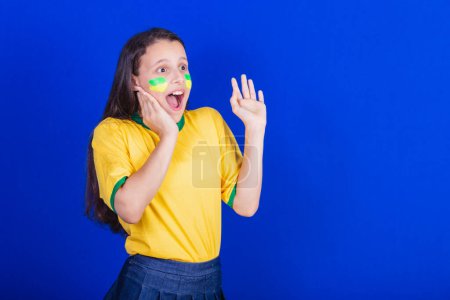 Photo for Young girl, soccer fan from Brazil. startled, surprised, surprised. - Royalty Free Image