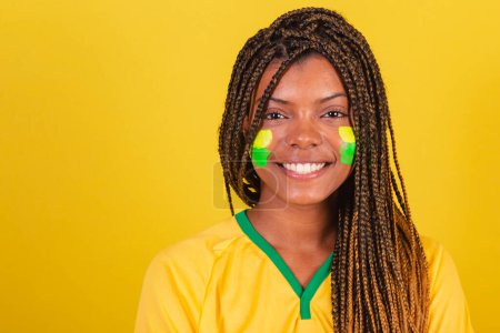 Photo for Black woman young brazilian soccer fan. close-up photo, smiling at camera, happy. - Royalty Free Image