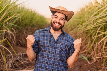 Photo for Brazilian Caucasian man, farmer, rural worker, agricultural engineer. celebrating, sawed hands, partying, wha. yes! - Royalty Free Image