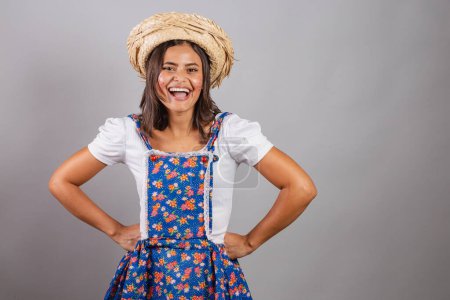 Photo for Brazilian woman wearing country clothes, So Joo party, Junina party. smiling happy - Royalty Free Image