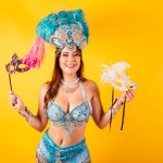Horizontal, half body shot, beautiful Brazilian woman in carnival clothes. dancing, with carnival mask.