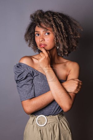 Photo for Beautiful black brazilian woman posing on grey studio background - Royalty Free Image