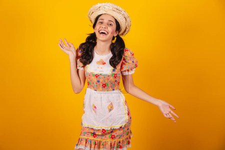 Photo for Beautiful Brazilian woman, with June party clothes, laughing, having a lot of laughter. - Royalty Free Image