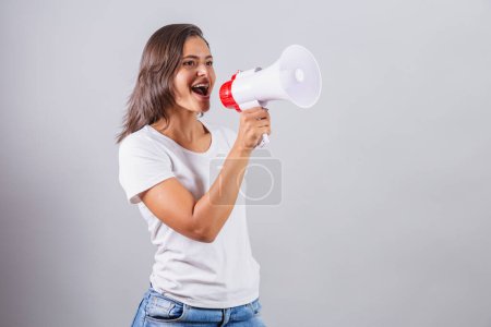Photo for Brazilian woman with megaphone announcing advertisement, promotion, marketing - Royalty Free Image