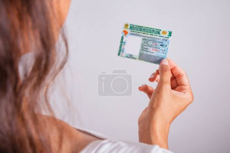 Photo for Hand holding driver's license, Brazilian document. - Royalty Free Image