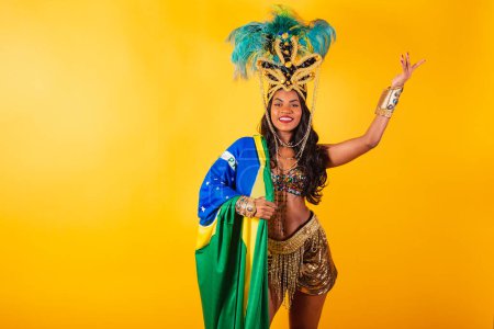 Photo for Horizontal, half body, black Brazilian woman in carnival clothing. with brazil flag. - Royalty Free Image