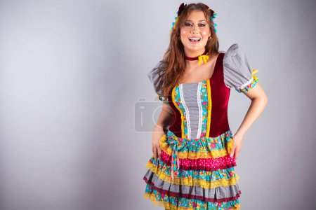 Photo for Beautiful Brazilian woman wearing country clothes, for Festa de So Joo, Festa Junina. Posing for photo. Half body photo. - Royalty Free Image