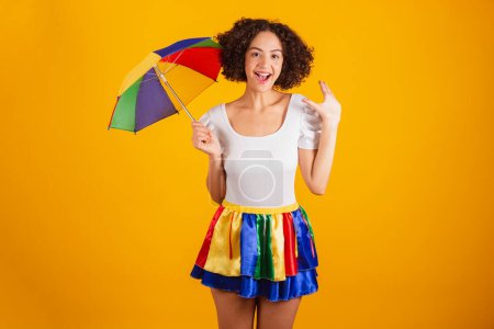 Photo for Beautiful Brazilian woman, dressed in carnival clothes, colorful skirt and white shirt. incredible, unbelievable. - Royalty Free Image