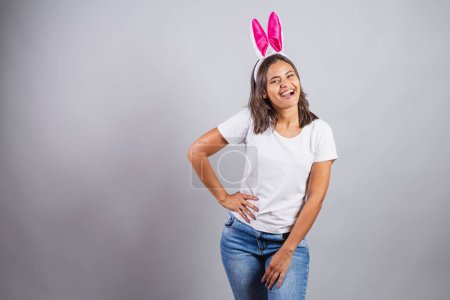Photo for Brazilian woman, with bunny ears, Easter, smiling happily, wow. - Royalty Free Image