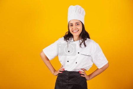 Photo for Brazilian woman, head chef, cook, with hands on hips smiling. - Royalty Free Image