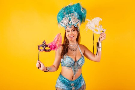 Photo for Horizontal, half body shot, beautiful Brazilian woman in carnival clothes. dancing, with carnival mask. - Royalty Free Image