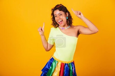 Photo for Beautiful Brazilian African American girl, in carnival clothes, dancing. - Royalty Free Image