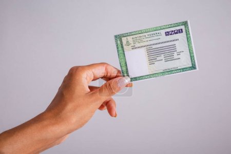 Hand holding identity card. document. Brazilian.