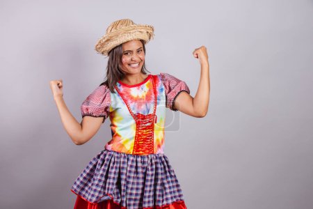 Photo for Brazilian woman wearing country clothes, So Joo party, Junina party. celebrating, vibrating. - Royalty Free Image
