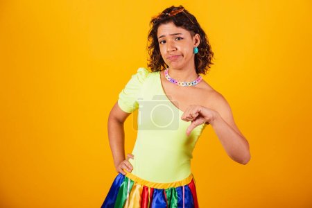 Photo for Beautiful afro american brazilian girl, with carnival clothes, sign of dislike with hands. - Royalty Free Image