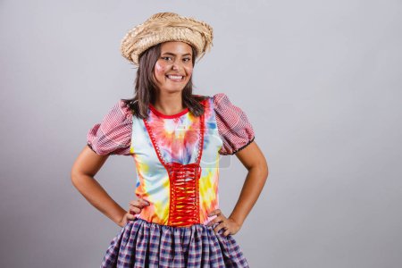 Photo for Brazilian woman wearing country clothes, So Joo party, Junina party. hands on waist - Royalty Free Image