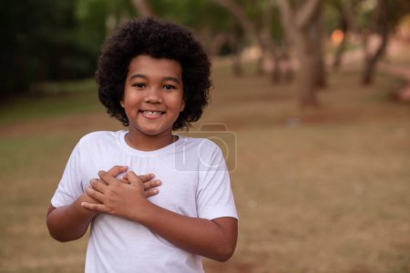 Photo for Afro boy gratitude in the park - Royalty Free Image