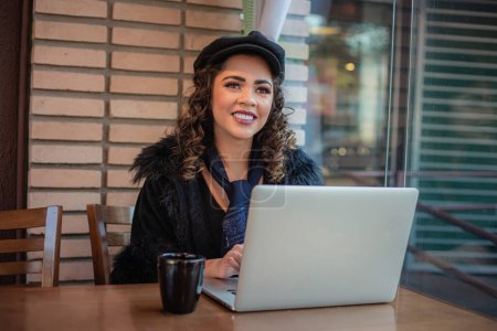 Photo for Afro woman working remotely using her laptop. - Royalty Free Image