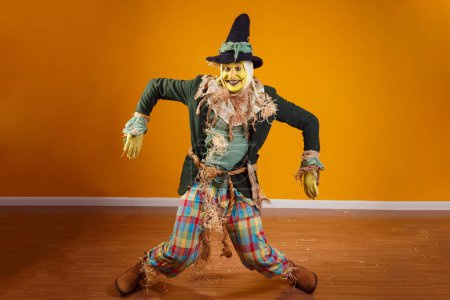 Photo for Photo of scarecrow character from festa junina on yellow background with space for text - Royalty Free Image