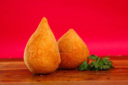 Photo for Coxinha, traditional Brazilian cuisine snacks stuffed with chicken - Royalty Free Image
