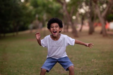 Photo for Little afro boy grimacing at camera - Royalty Free Image