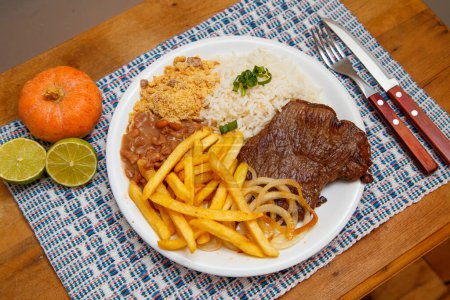 Photo for Rice, beans, french fries and beef steak - Royalty Free Image