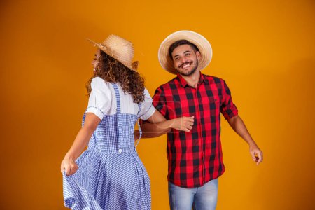 Photo for Brazilian couple wearing traditional clothes for Festa Junina - June festival - Royalty Free Image