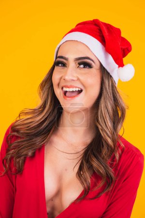 Photo for Beautiful woman dressed as mama claus. Beautiful woman in Santa hat smiling - Royalty Free Image