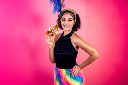 Photo for Beautiful woman dressed for carnival night. Afro woman with carnival makeup - Royalty Free Image