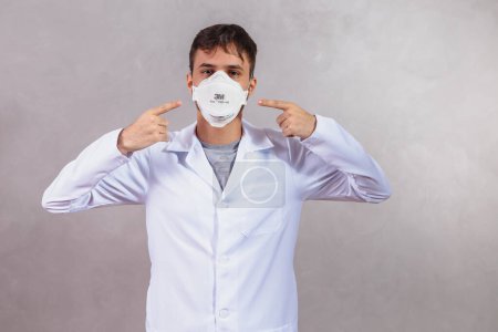 Photo for Photo of nurse on gray background with protective mask - Royalty Free Image