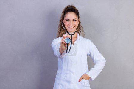 Photo for Close-up of female doctor using stethoscope , focus on stethoscope - Royalty Free Image