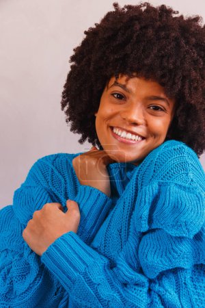 Photo for Afro woman dressed for winter - Royalty Free Image