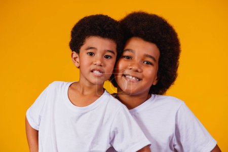 Photo for Afro brothers on yellow background. brother's day - Royalty Free Image
