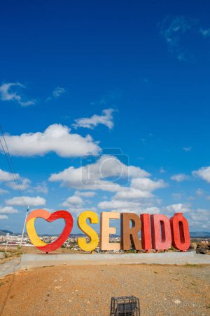 Photo for Serido, Rio Grande do Norte, Brazil - March 12 2021:  I Love Serido message in Portuguese  on Brazil with people. Vertical - Royalty Free Image