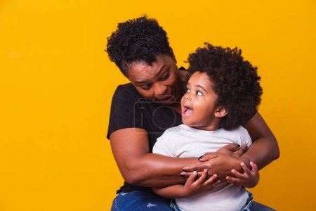 Photo for Happy mother's day! Adorable sweet afro-american mother with cute little daugh. Older mother with her daughter on yellow background. - Royalty Free Image