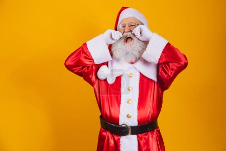 Photo for Santa Claus crying with his hands in his eyes. - Royalty Free Image