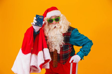 Photo for Santa Claus holding the Brazilian passport - Royalty Free Image