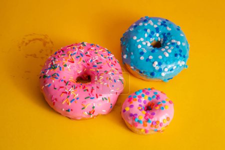 Photo for Delicious donuts coloring on yellow background - Royalty Free Image