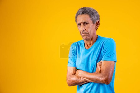 Photo for Old man on yellow background throwing a tantrum - Royalty Free Image