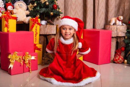 Photo for Adorable child girl dressed in christmas outfit. - Royalty Free Image