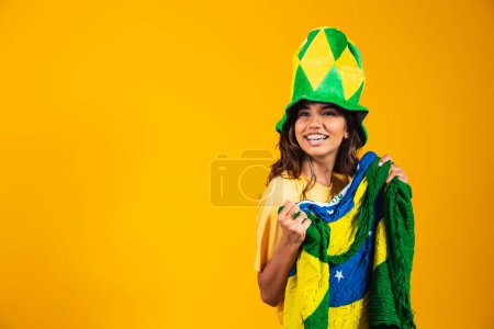 Photo for Brazilian celebrating the independence of Brazil. September 7th. Brazilian fan - Royalty Free Image