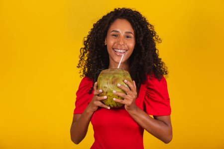 Photo for Woman drinking a coconut water - Royalty Free Image
