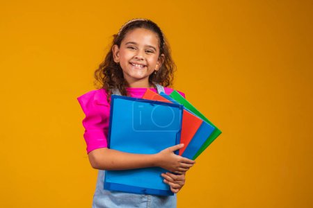 Photo for Child care and happy childhood, pretty girl with books ready to first day at school. - Royalty Free Image