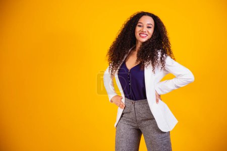 Photo for Beautiful african american woman looking at camera. Portrait of cheerful young woman with afro hairstyle. Beauty girl with curly hair. - Royalty Free Image