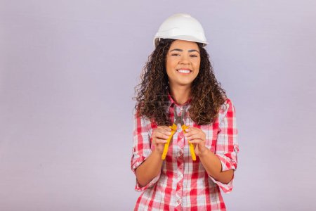 Photo for Female technique. Electrician woman on white background with space for text. - Royalty Free Image