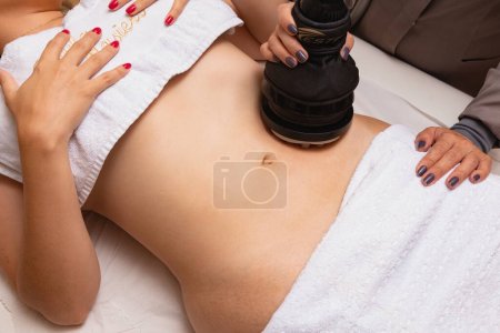 Photo for Aesthetic belly treatment with vibrocel - Royalty Free Image