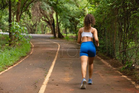 Photo for Woman running in the park. - Royalty Free Image