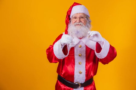 Photo for Santa Claus with syringe and vaccine in hand. Santa Claus holding the covid vaccine - Royalty Free Image