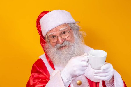 Photo for Santa Claus having a cup of coffee or tea - Royalty Free Image